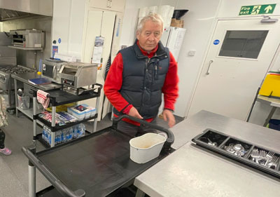 Paul Caddy ready to prepare meals in Wesley’s Café kitchen.