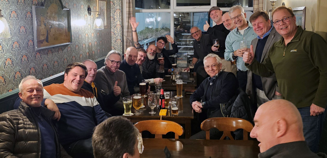 Brethren gather at The Windmill pub, sharing camaraderie before the meal.