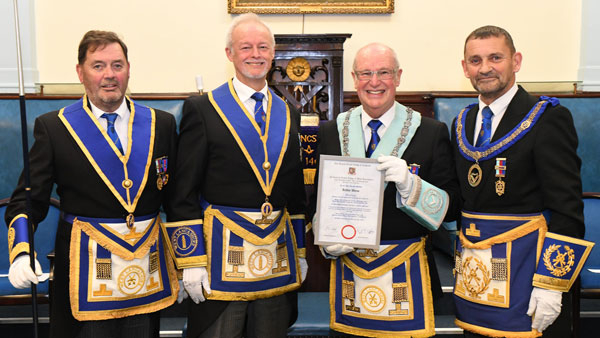 Pictured from left to right, are: Greg Pinnington, Phil Stock, Arthur Waine proudly holding his jubilee certificate and David Thomas