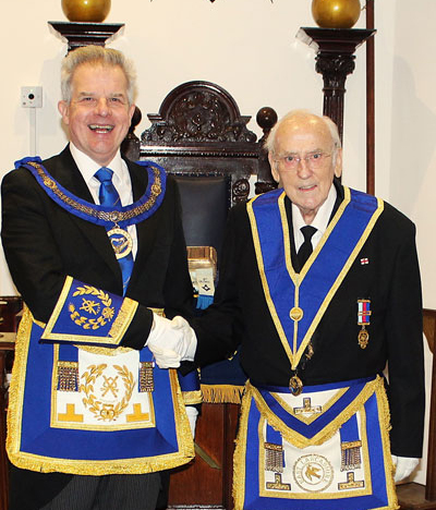 Stuart Boyd (left) congratulates Wilf Knight on his 50th anniversary.