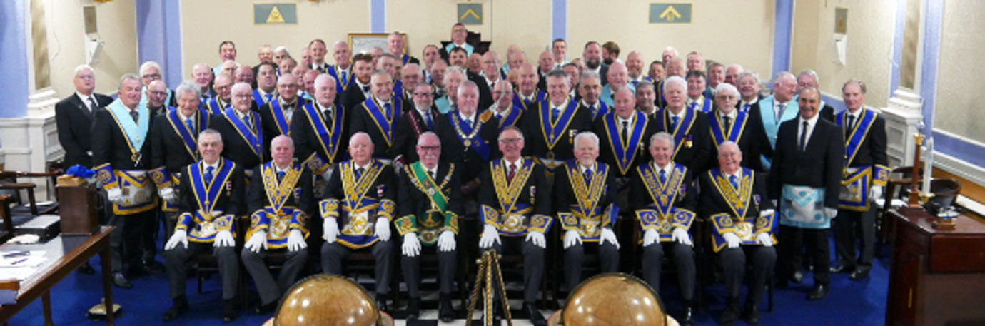 Pictured seated from left to right, are: Steve Jelly, Duncan Smith, Harry Cox, James L Jack, John Robbie Porter, David Randerson, Stuart Thornber and James Woods with the members of Emblem Lodge and guests standing.