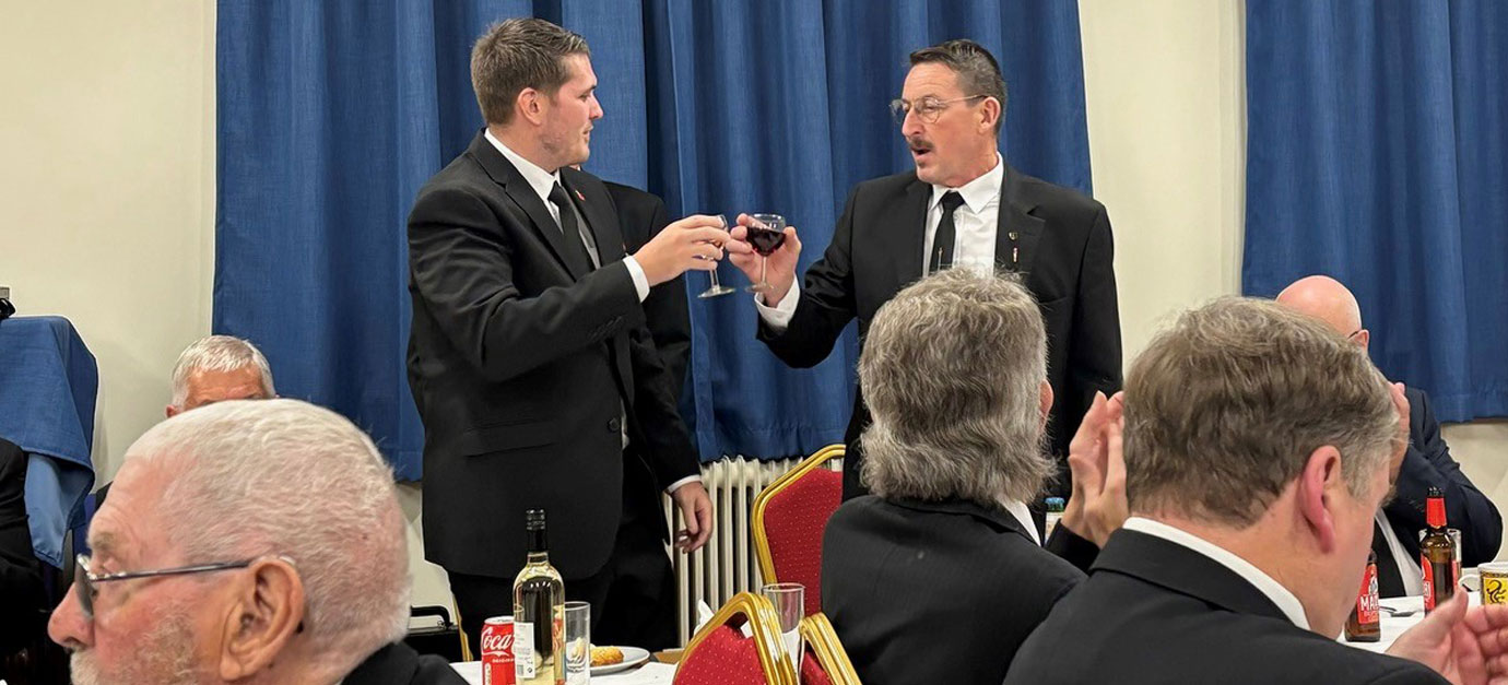 Ian Hainsworth (right) toasting Chad’s health.