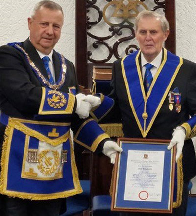 Peter Lockett gifting John Longworth his 50-year certificate, with John Rhodes.