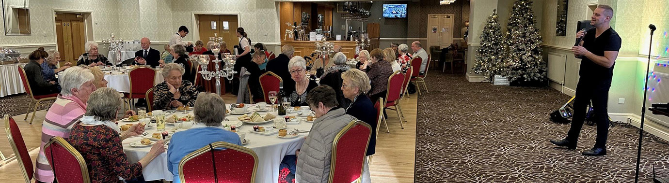 Guests enjoying their afternoon tea and entertainment.