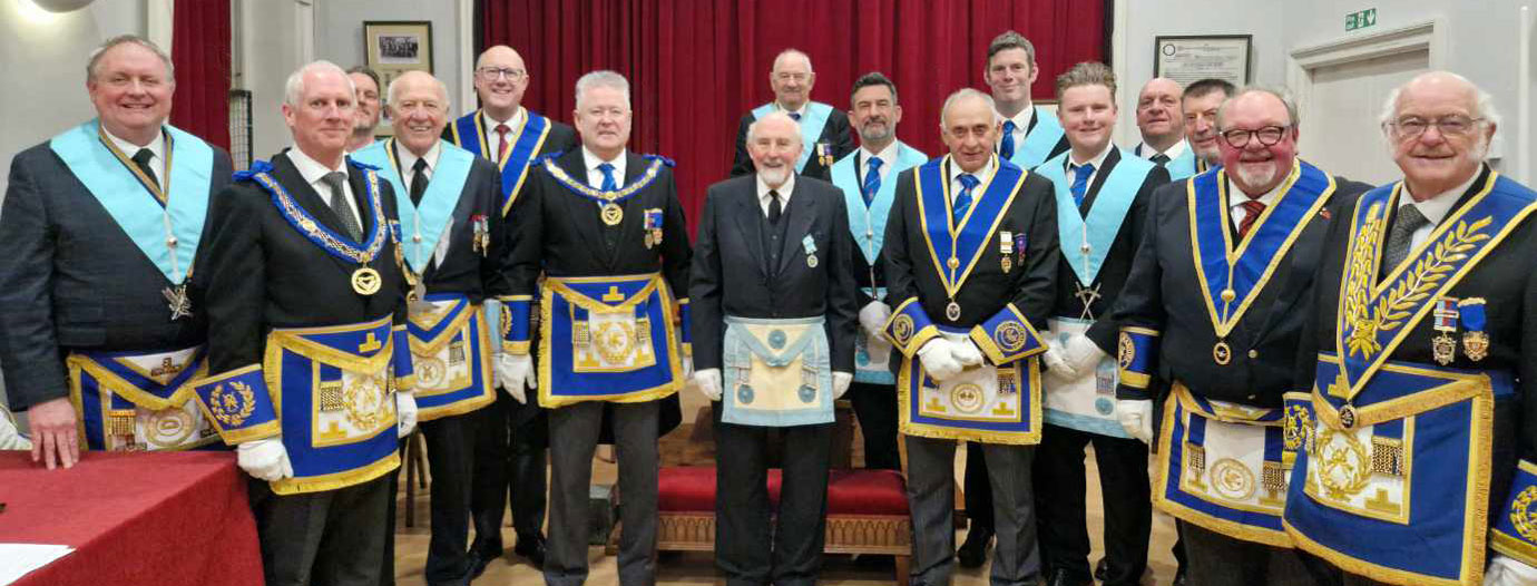 The brethren of Hawkshead Lodge join Derek Adams (centre)on the floor of the lodge.