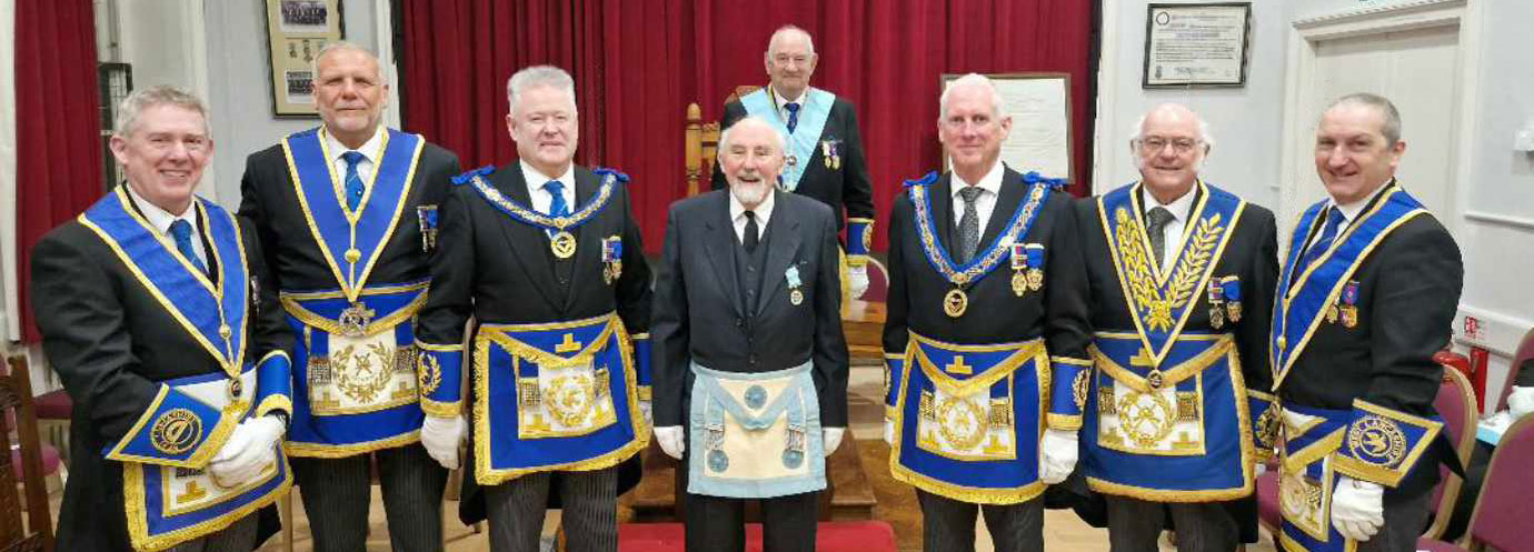 The grand officers, group chairman and group secretary join Derek Adams (centre), David Cole (WM) and Peter Schofield (centre left).