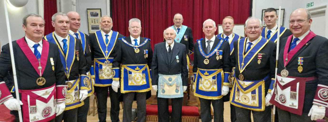 Acting Provincial grand officers with Derek Adams (centre) and Peter Scofield (centre left).