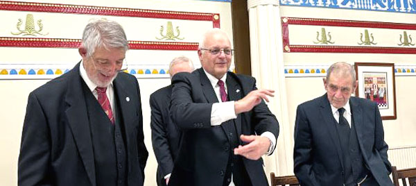 The three principals respond to the toast to their health, from left to right, are: John Marsden, John Reynolds and Stan Dawkins, under the watchful eye of the DC standing behind.