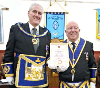 Andrew Whittle (left) presents the certificate to Barrie Collinson.