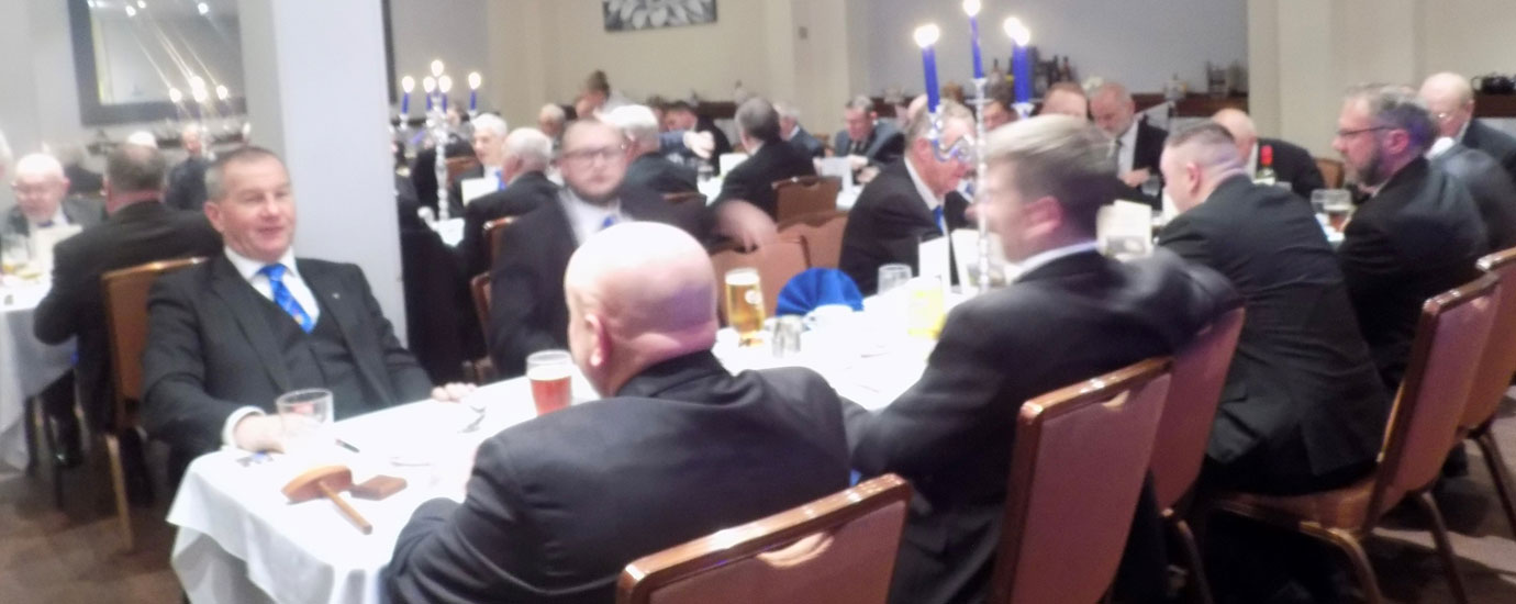 Brethren at festive board enjoying the evening.