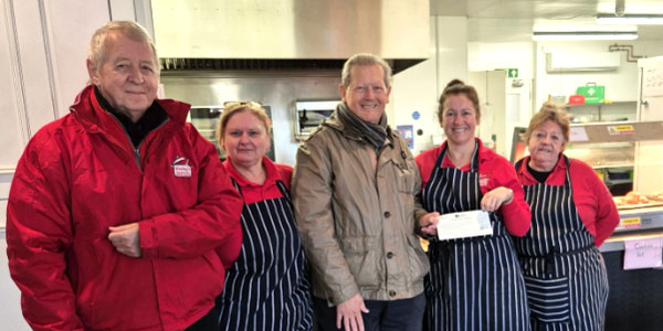 Tony Smith (centre) of Semper Fidelis Lodge presents Wesley’s Cafe with a £2,000 cheque. 