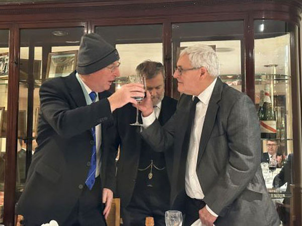 Ray Erskine (right) toasts Alan on achieving his golden jubilee.