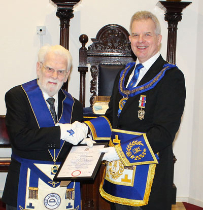 Stuart Boyd (right) congratulates Trevor Edmonds on his 50th anniversary.