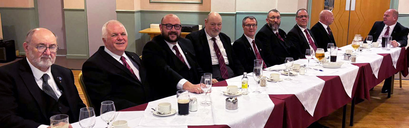 Companions enjoying the wonderful meal, wine and company at the festive board.