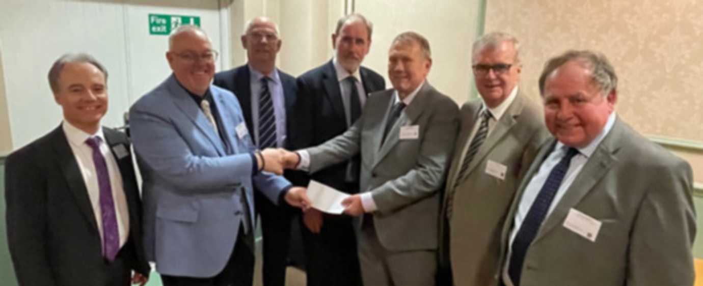 Pictured from left to right, at the cheque presentation from the group holiday, are: Jonathon Heaton, Ian Green, Dave Whitmore, Frank Umbers, Dave Brogan, John Selley and Graham Chambers.