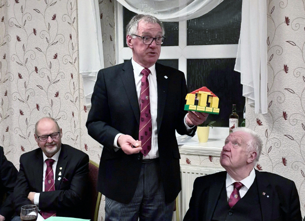 John Robbie Porter, proudly displaying his Lego model of the principles of Freemasonry.