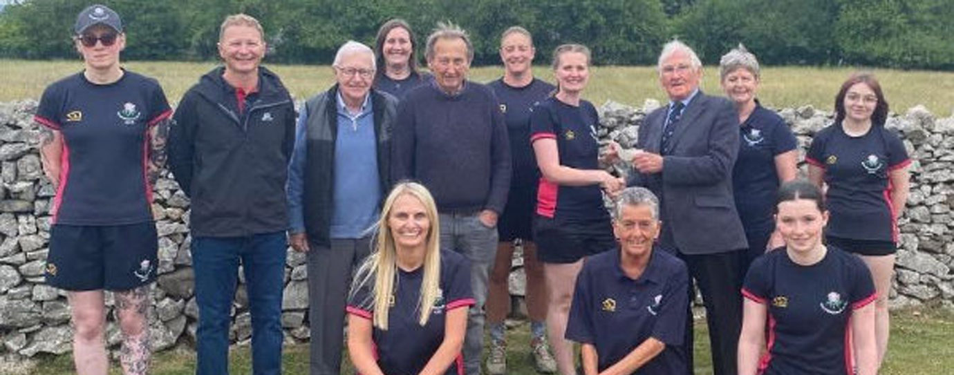 Peter Mason presents a £1,000 cheque to Silverdale Cricket Club Ladies Section.