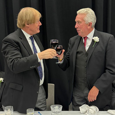Sir David (left) and Mark take wine together.
