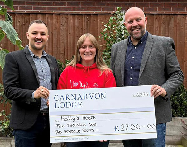 Pictured from left to right, are: Adam Dennett, Jenny Prince and Chris Upton at the cheque presentation.