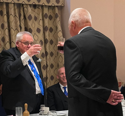 John Hill toasting Graeme Scott (left) during the Master’s Song.