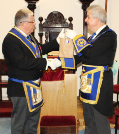 Stuart Boyd (right) receives some traditional ‘Trafford Treats’ from Jerry Lawes.