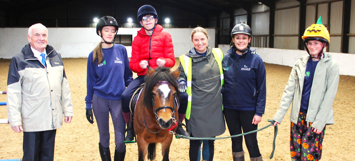 Luke mounted on Bo-Peep guided by coaches Katy, Caroline and assistants, watched by Trafford Group Chairman Patrick Walsh.