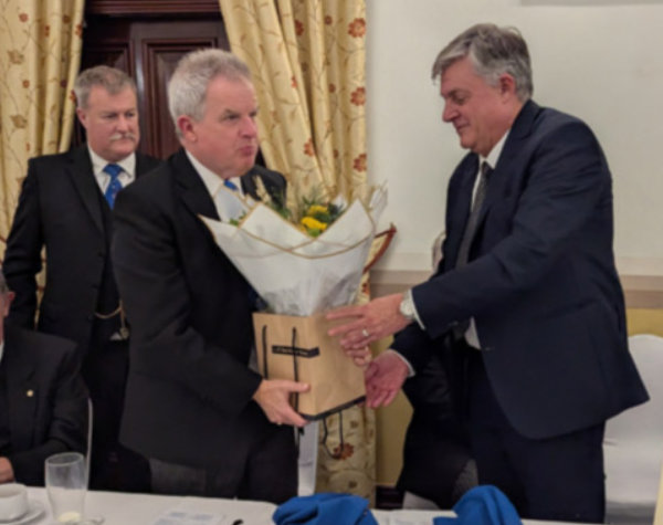 Robert Beeton (right) presenting Stuart Sutherland Boyd with some flowers. Robert Beeton (right) presenting Stuart Sutherland Boyd with some flowers.