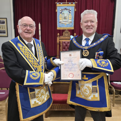 Dave Kellet (left) is presented with his diamond jubilee certificate by Peter Schofield