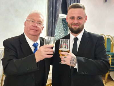 John Roughley acting WM (left) congratulating Daniel at the festive board.