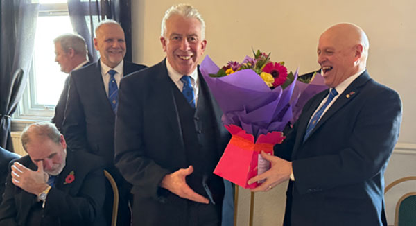 David Atkinson (right) presents Mark Matthews with flowers.