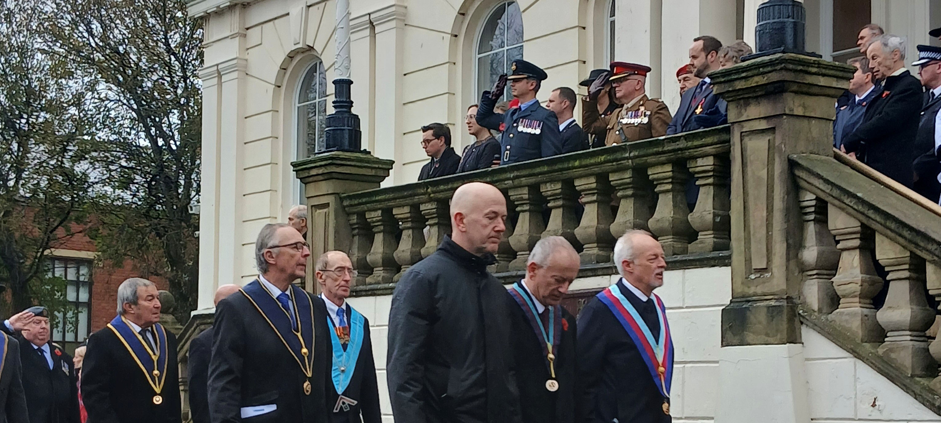 Southport Masons march past the principal guests.
