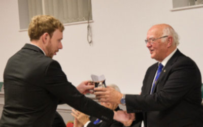 David Banks (left) being presented with the silver tankard by David Ogden. 