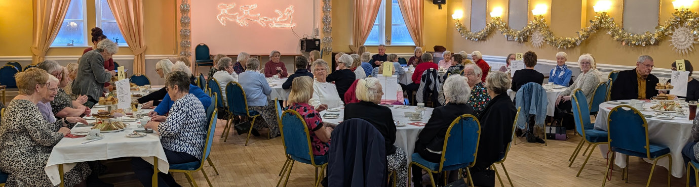 Everyone enjoying their widow’s luncheon.