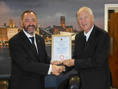 Andrew Aitchison (left) with Arthur and his certificate.