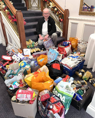 Jon Hardman (centre) with the food donation at St Anne’s Palace.