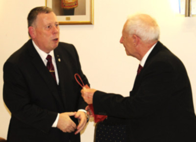Colin (left) presents Trafford treats to Stuart.