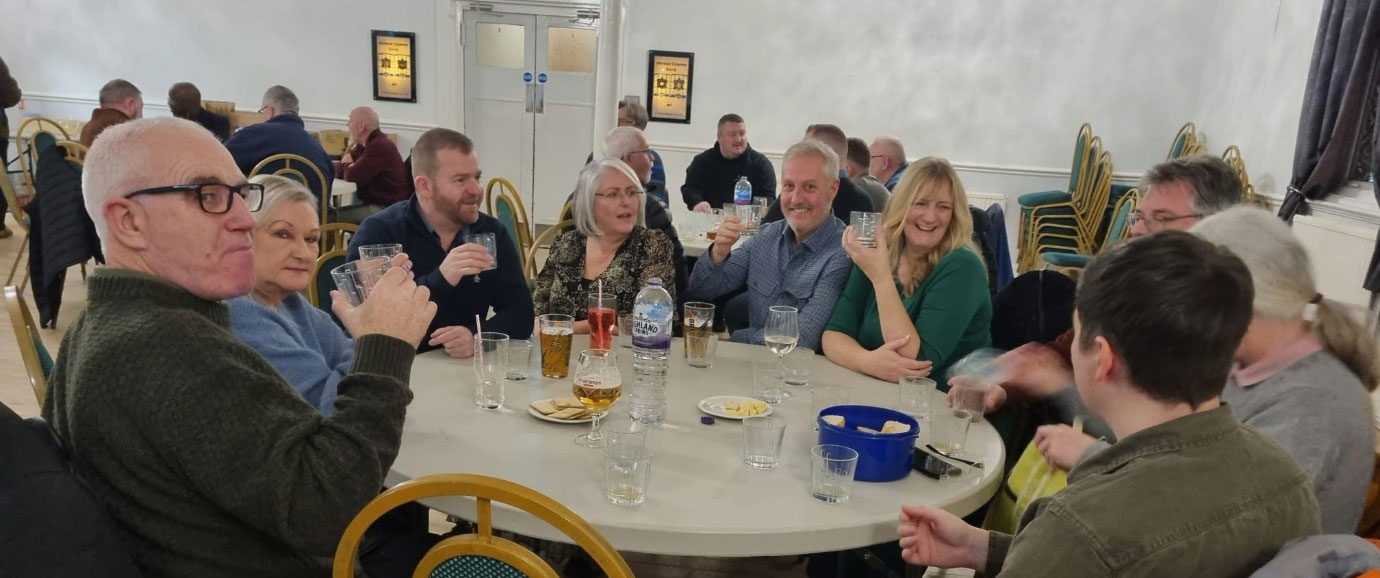 Attendees toast Dave for a fantastic night.