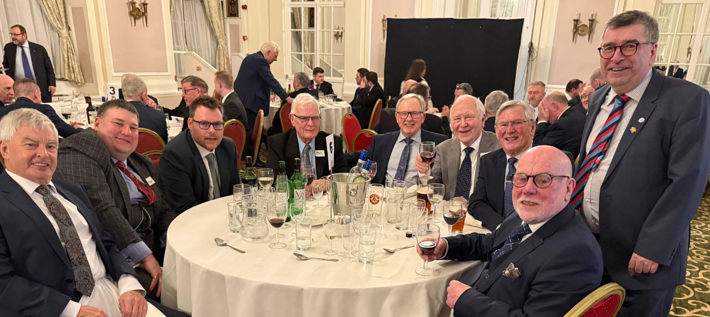 Members of Harmonic Lodge and City Chapter enjoying a glass or two with Paul McClachlan (right).