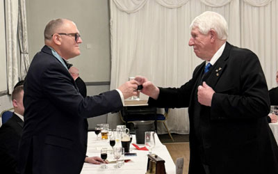 Norman (right) toasts Gary during the Master’s Song.