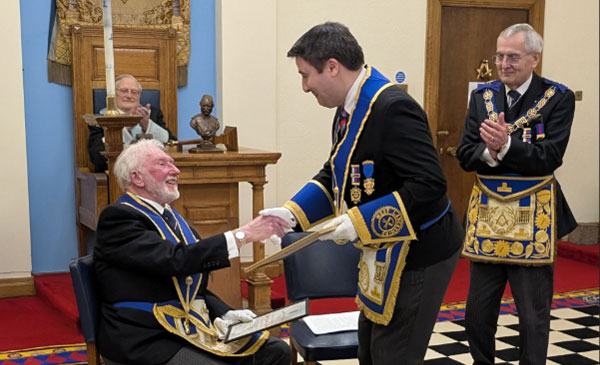Mick Southern (centre) congratulates Bernard Bailey.