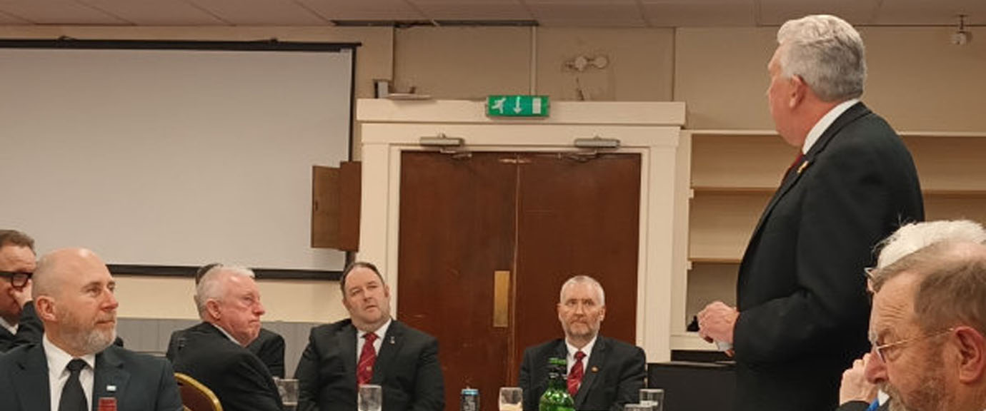 Mark Matthews (standing) responds to the toast to his health.