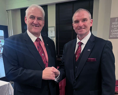 Andrew (left) congratulates Paul as first principal of the chapter