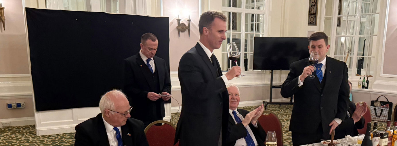 Tom Murphy (right) takes wine Paul Storrar.