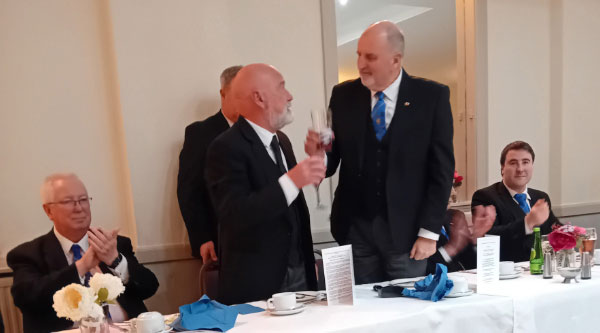 Bob Rowland (standing left) receiving the toast from Kevin Flynn. Bob Rowland (standing left) receiving the toast from Kevin Flynn.