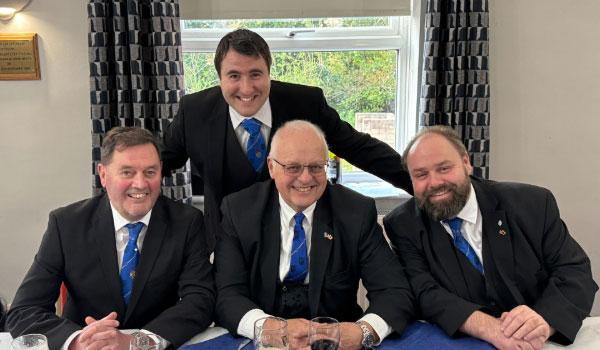 Greg, John, Ezra and Mick (standing), enjoying the festive board.