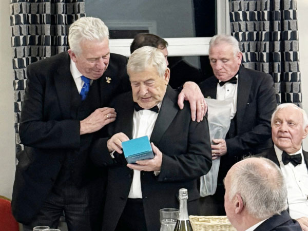 Kevin Langshaw gives Mark Matthews a bottle, and by Marks reaction he is very pleased with it.