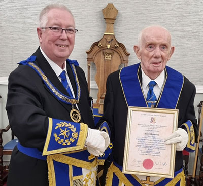 John Murphy (left) presents Harry Unsworth with his certificate. John Murphy (left) presents Harry Unsworth with his certificate.