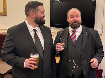 Paul Middleton (left) receives a toast from Ezra McGowan. Paul Middleton (left) receives a toast from Ezra McGowan.