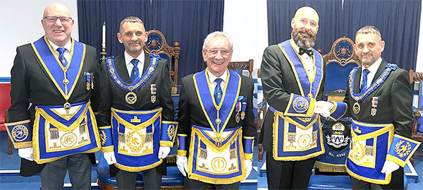 Pictured left from left to right, are: Stephen Dunn, David Thomas and Malcolm Sandywell. Pictured right: David Thomas (right) congratulates Paul Grainger.