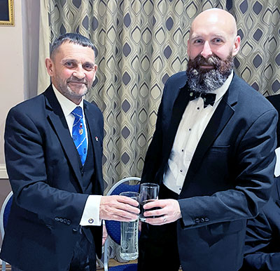 David Thomas (left) toasts the new master, Paul Grainger.